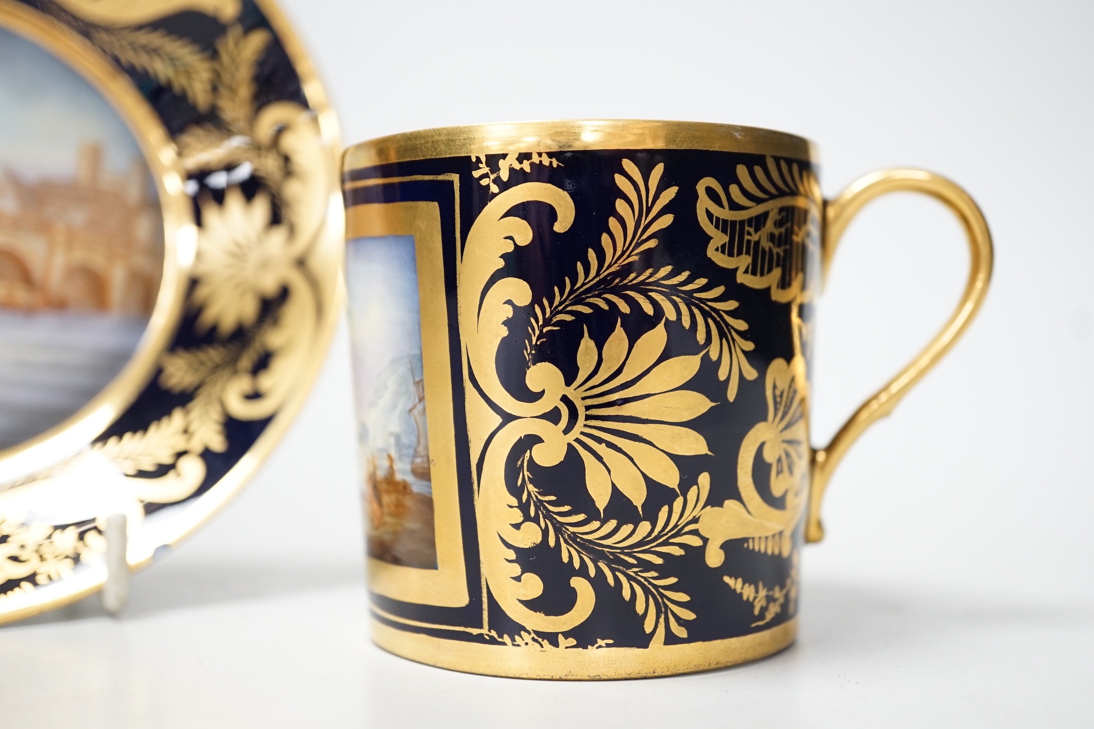 A Continental Derby style cup and saucer, 8cm tall overall